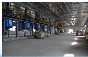 Reactor vessels and packaged materials inside a partner production hall